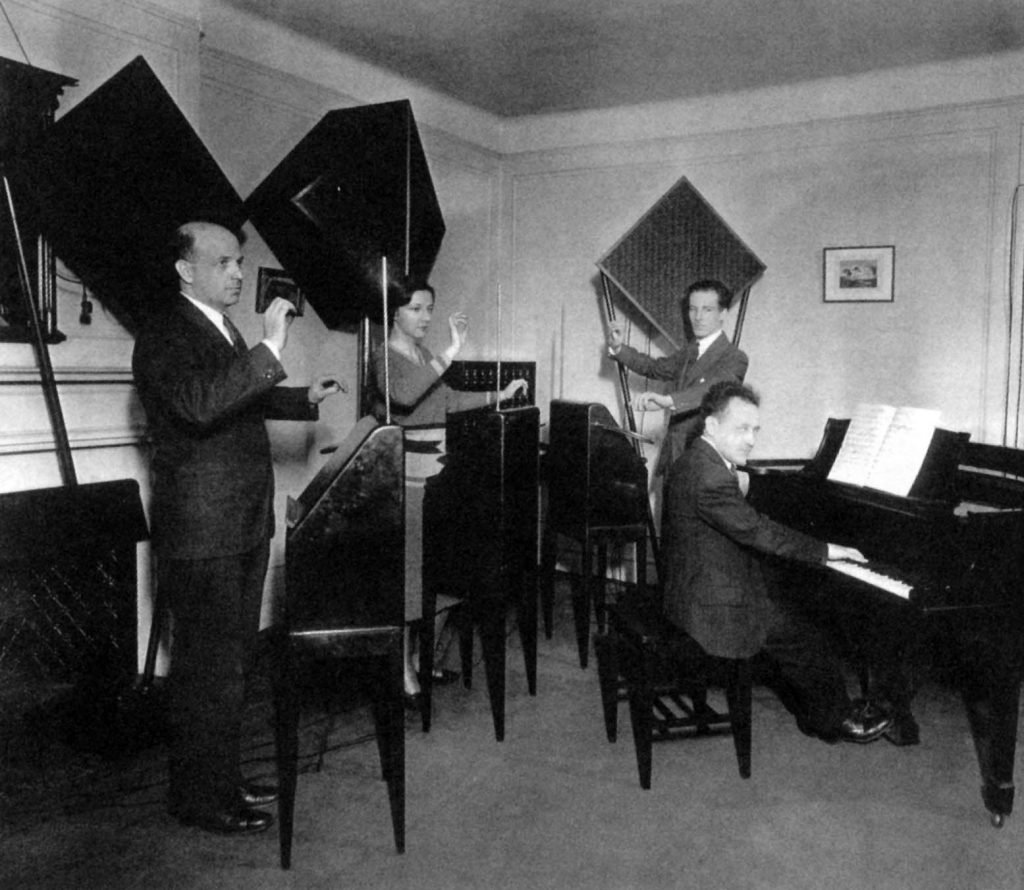 Photo of thereminist Zenaide Hanenfeldt playing with an ether Music Trio in 1930.